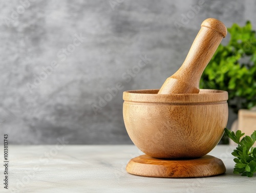 Wooden mortar and pestle on a marble countertop, ideal for grinding spices, herbs, or making sauces.