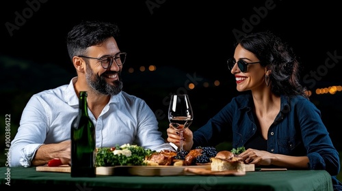 Romantic Night: Couple enjoying wine and cheese at night