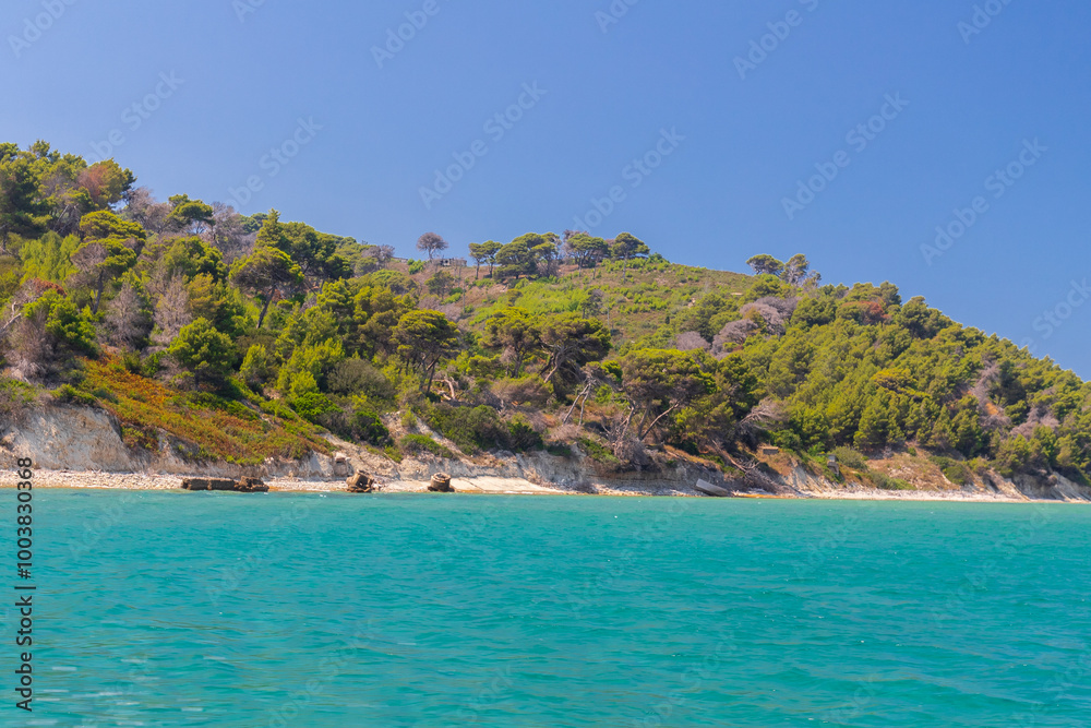 Naklejka premium Sazan is an Albanian uninhabited island in the Mediterranean Sea. It us the largest of Albania's islands and it was a designated military exclusion zone. It lies in a strategically important location