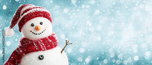  A snowman dons a red scarf and a hat with a red snowflake