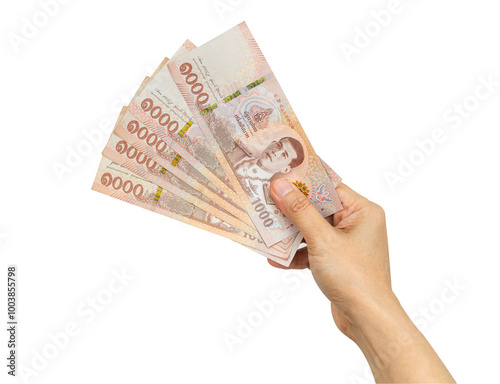 Thai baht banknotes cash money in woman hand isolated on white background with clipping path. photo