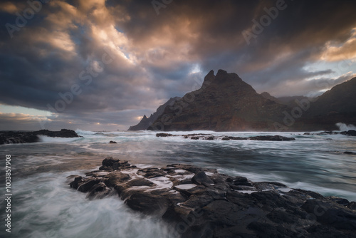 Obraz na płótnie Rocky coastline in Punta del Hidalgo in Tenerife- taken on long exposure time. Dramatic sky add a mood to this picture. w salonie