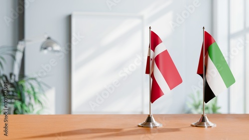 FLAGS OF DENMARK AND UAE ON TABLE