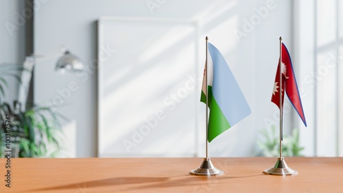 FLAGS OF DJIBOUTI AND NEPAL ON TABLE photo