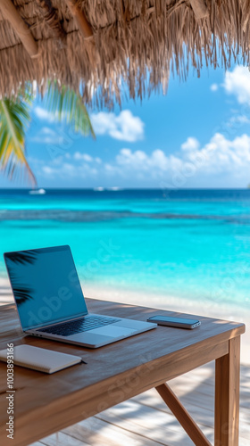 laptop on a table on beach - travel work concept for smartpone vertical wallpaper photo