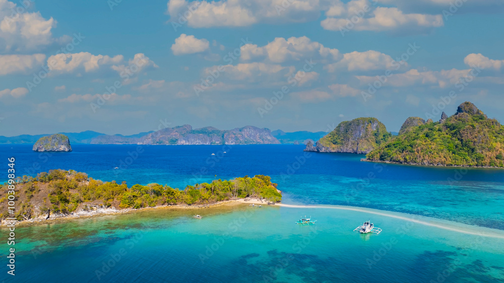 Aerail view of tropical exotic island sand bar separating sea in two with turquoise in El Nido, Palawan, Philippines. Aerail view of tropical exotic island sand bar separating sea in two with turquoise in El Nido, Palawan, Philippines.