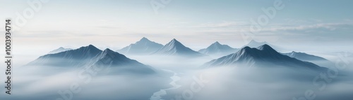 Serene mountain landscape shrouded in mist, creating a tranquil atmosphere and stunning natural beauty.