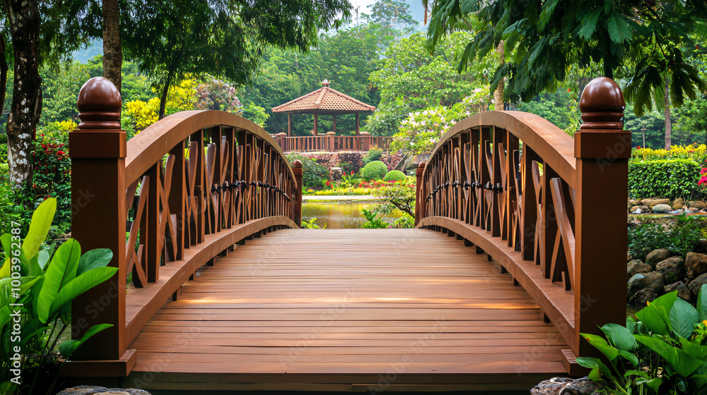 An elegant bridge with a wooden walkway through a park An elegant bridge with a wooden walkway through a park