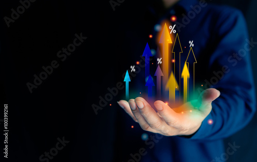 Bright business growth percentage. Many colorful small and big arrow bars compete to shoot straight up from the palm of a businessman—growth concept percentage symbol.