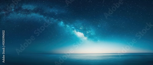 Captivating night sky over calm ocean waters with distant stars and milky way galaxy.