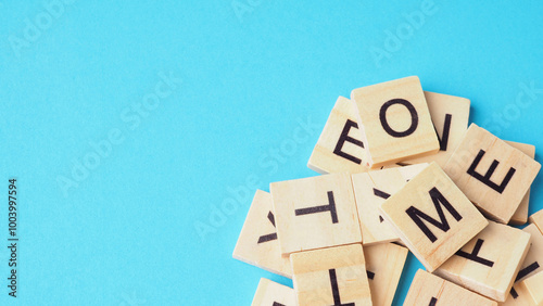Wooden letter cubes isolated on blue background