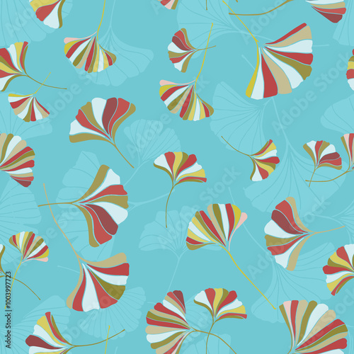 A seamless pattern of ginkgo leaves in  various colors on a blue background, a variation of hand-drawn ginkgo leaves