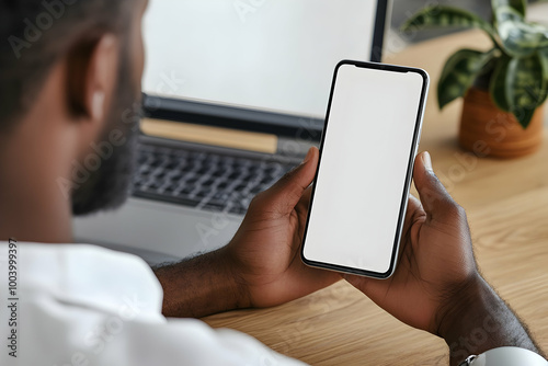 African American Hands Holding Smartphone with Blank Screen: Modern Technology Usage in Office Environment