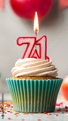 Birthday cupcake with burning lit candle with number 71. Number seventy-one for seventy-one years or seventy-first anniversary.