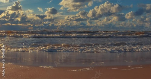 Strong waves roll over the sea beach.