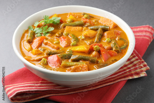 Mix vegetable curry - Indian main course recipe contains Carrots, cauliflower, green peas and beans, baby corn, capsicum