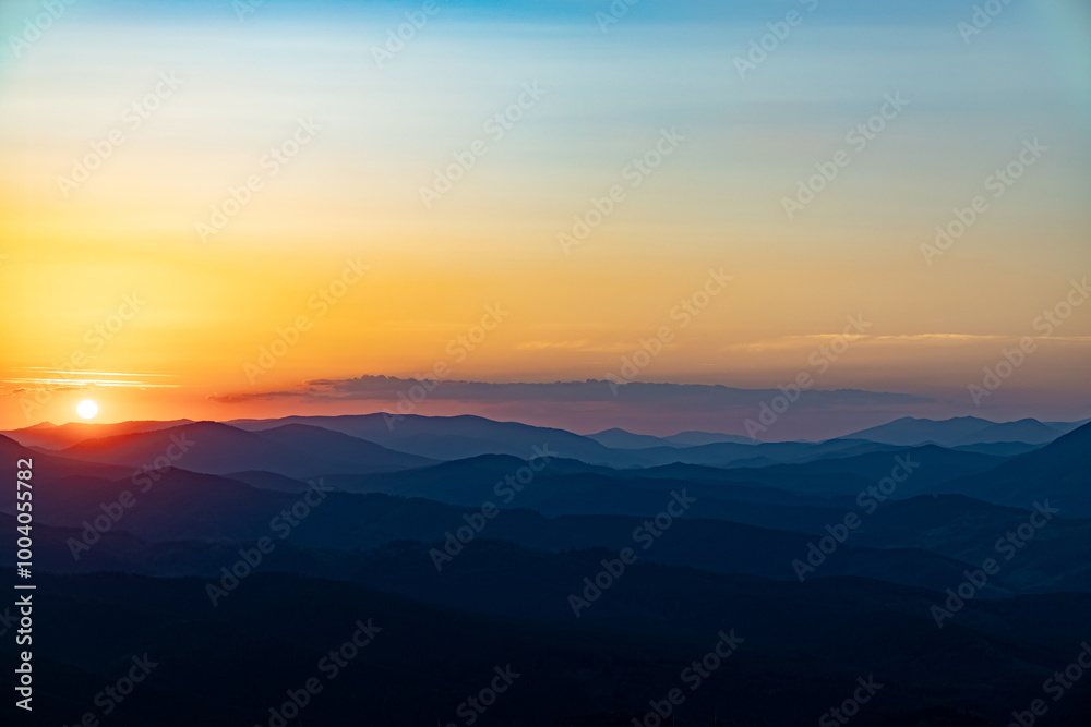 Sunset on the top of the mountain, mountain peaks on the background of the mountain landscape. Sunset on the top of the mountain, mountain peaks on the background of the mountain landscape.