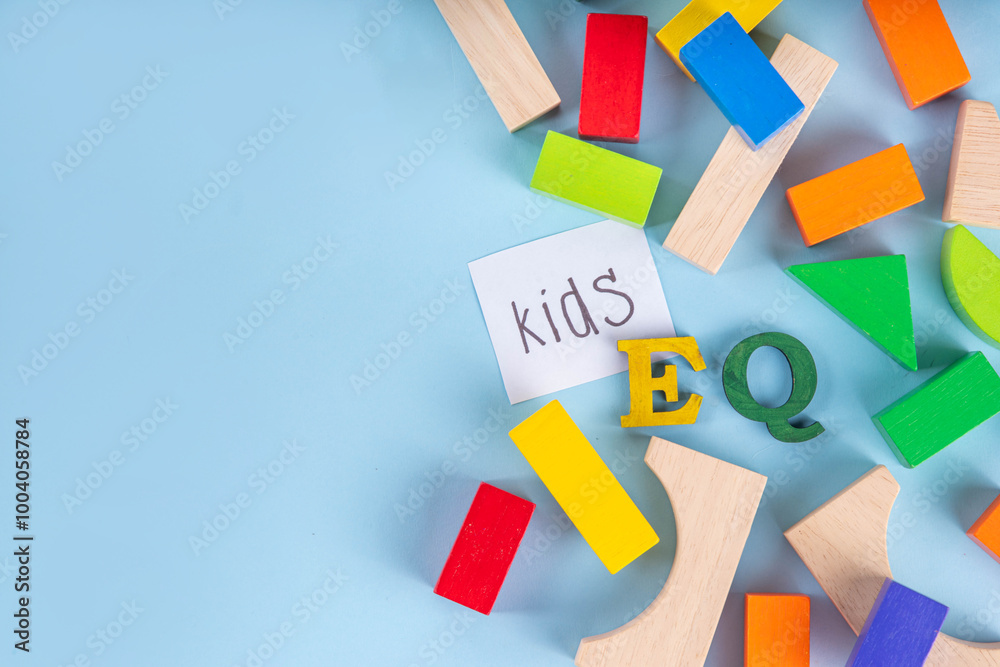 Kids EQ, child emotional quotient concept with wooden cubes children toys on background, wooden cubes kids toys on background, letters text lettering EQ in the foreground Kids EQ, child emotional quotient concept with wooden cubes children toys on background, wooden cubes kids toys on background, letters text lettering EQ in the foreground