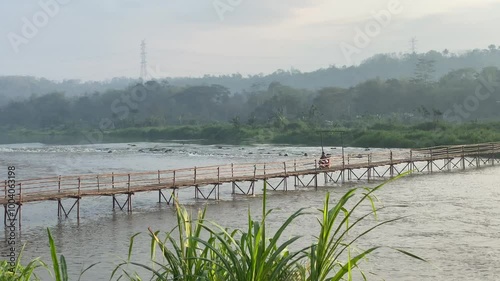 Sesek Temben Bridge, Progo River, a bridge that uses wood as a connecting material between Bantul and Kulonprogo villages. photo