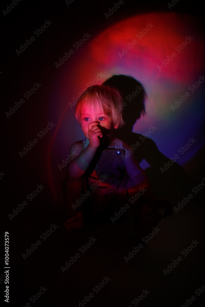 silhouette of a child in the night with different light effects