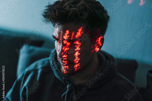 close-up portrait of a male person in a cyberpunk environment with red lights in his face