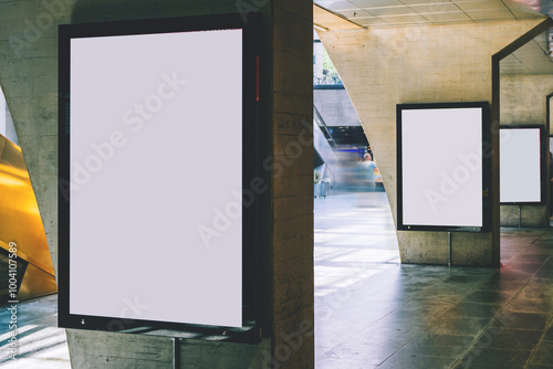 Fototapeta Naklejka Na Ścianę i Meble -  Clear Billboard in public place with blank copy space screen for advertising or promotional poster content, empty mock up Lightbox for information, blank display in station area with daylight