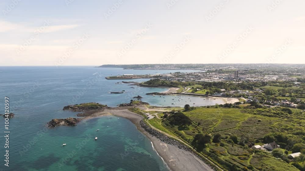 Guernsey Bordeaux Harbour.High drone flight over Bordeaux Harbour at mid tide flying towards St Sampson and St peter Port with boats,beaches, clear water and calm sea on bright sunny day Guernsey Bordeaux Harbour.High drone flight over Bordeaux Harbour at mid tide flying towards St Sampson and St peter Port with boats,beaches, clear water and calm sea on bright sunny day