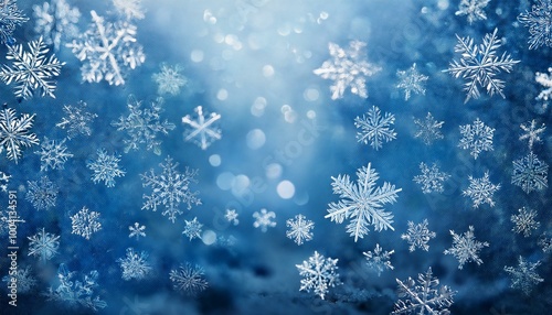 Christmas Background: A frosty blue background with shimmering silver snowflakes falling delicately. photo