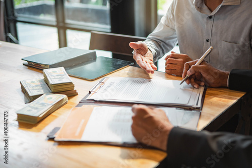 Customer shaking hands after signing contract documents for realty purchase, Bank employees congratulate, Concept mortgage loan approval. Business loan from a bank employee. finance concept .