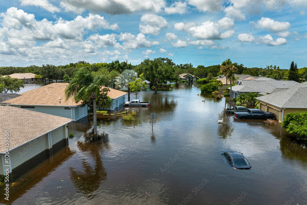 Fototapeta premium Flooded Florida street with stuck car after hurricane Debby rainfall surrounded with water. Consequences of natural disaster