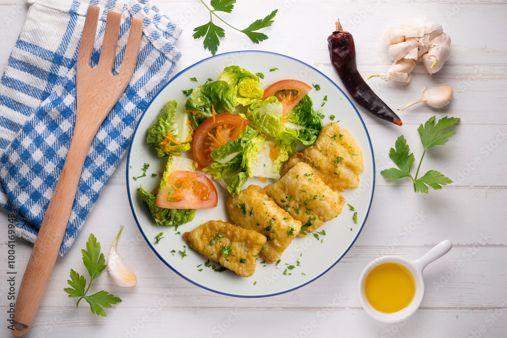 Tempura hake pieces with salad. Top view table with decoration. Tempura hake pieces with salad. Top view table with decoration.