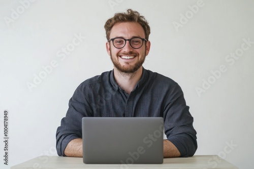 Smiling man with laptop glasses background happy.