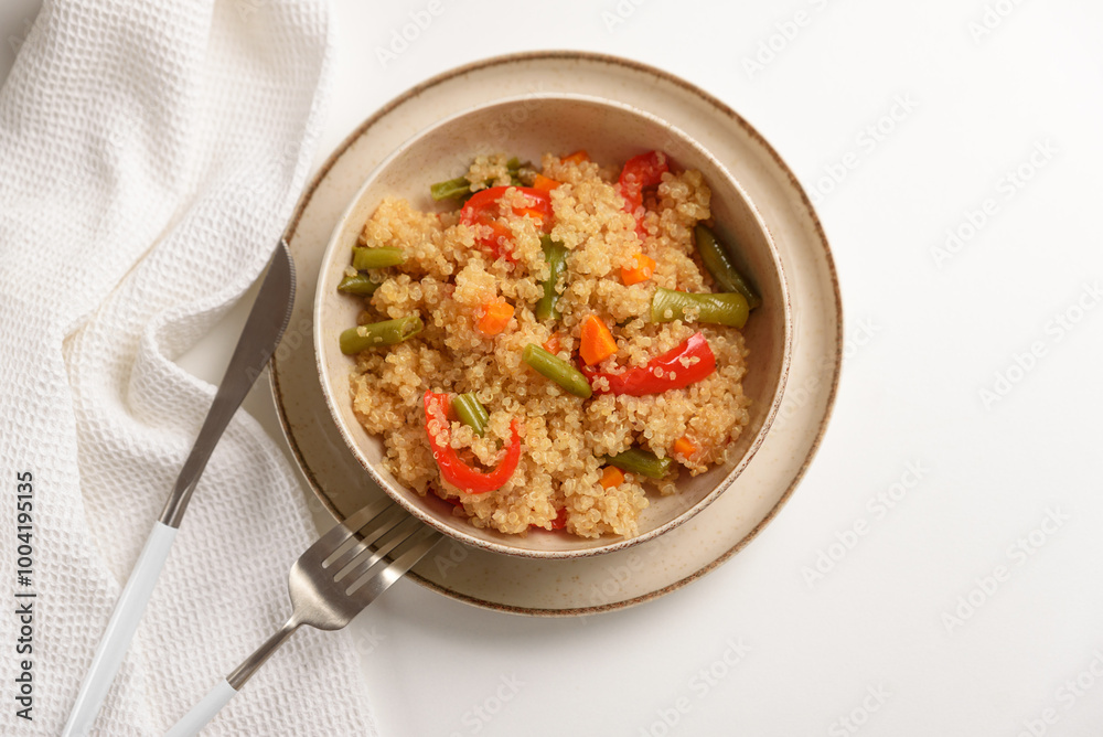 Quinoa vegetable salad on white wooden table. Vegetarian and diet food Quinoa vegetable salad on white wooden table. Vegetarian and diet food