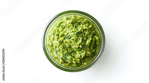 A green guacamole dip in a clear glass bowl, photographed from above. The background is white and you can easily cut out the image.