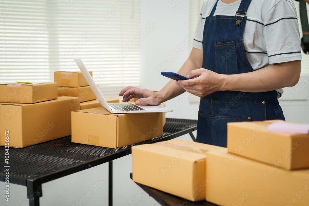A man is working at his desk, preparing parcel boxes for shipment. He checks and packs items carefully, using shockproof materials, and attaches labels before sending them to customers via EMS. A man is working at his desk, preparing parcel boxes for shipment. He checks and packs items carefully, using shockproof materials, and attaches labels before sending them to customers via EMS.