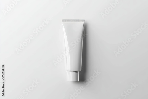 White cosmetic plastic tube isolated on gray background. An excellent mockup for branding and design. High-resolution image.