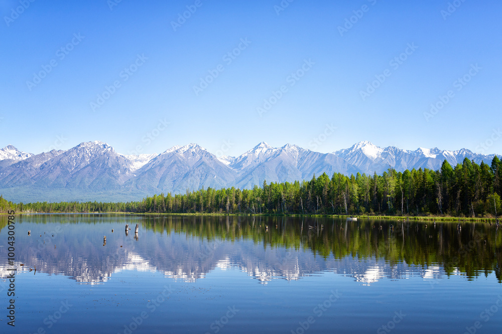 Russia. Landscape with mountains reflecting in the water on summer day. Buryatia, Tunkinskaya valley Russia. Landscape with mountains reflecting in the water on summer day. Buryatia, Tunkinskaya valley