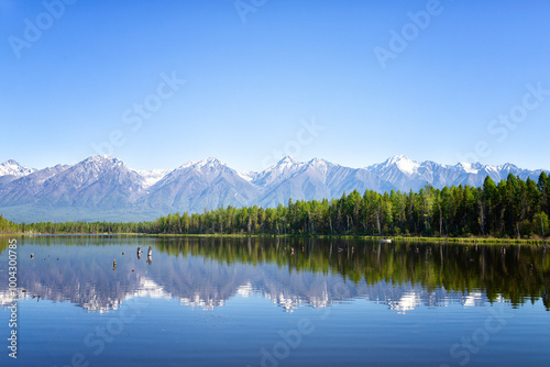 Russia. Landscape with mountains reflecting in the water on summer day. Buryatia, Tunkinskaya valley