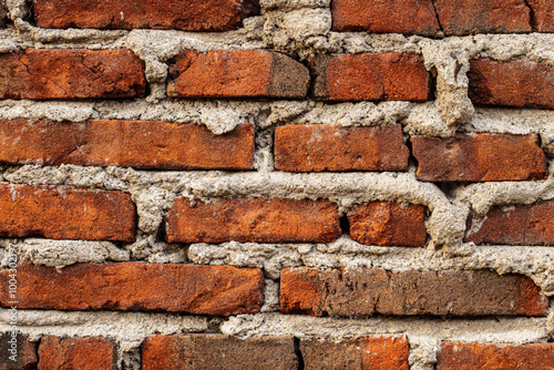 antique brick wall background, ancient red brick masonry surface photo