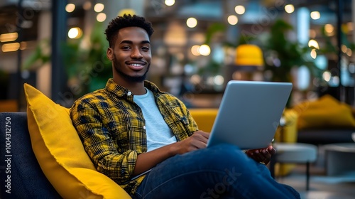 Young Man Using Laptop in C...