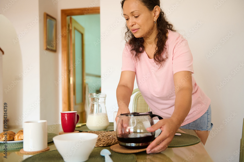 Woman preparing breakfast with coffee and pastries at home Woman preparing breakfast with coffee and pastries at home