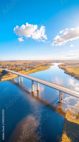 Stunning Drone View of a Bridge Over a Wide River Connecting Two Vibrant Towns