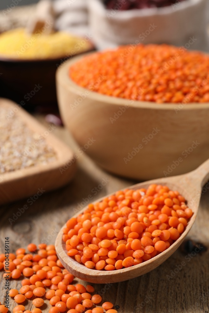 Natural lentils on wooden table, closeup view