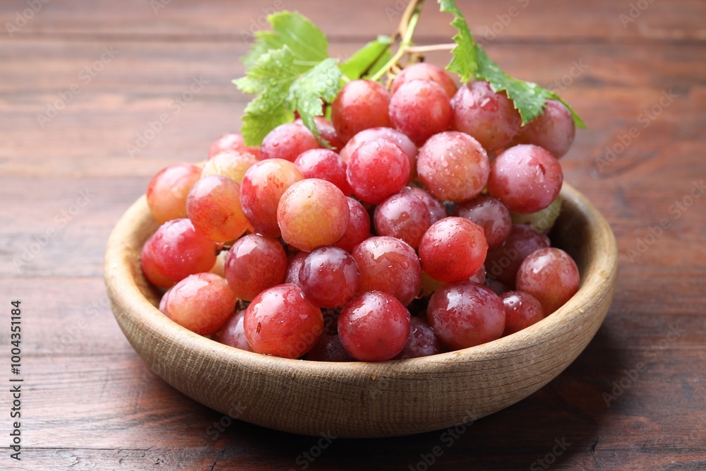 Fresh ripe grapes on wooden table, closeup Fresh ripe grapes on wooden table, closeup
