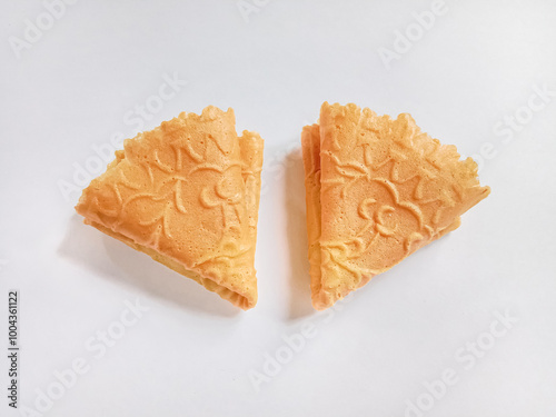 Kue semprong, Asian egg roll, sapit, sepit or kapit. Indonesian traditional wafer snack made by clasping egg batter using an iron mold.