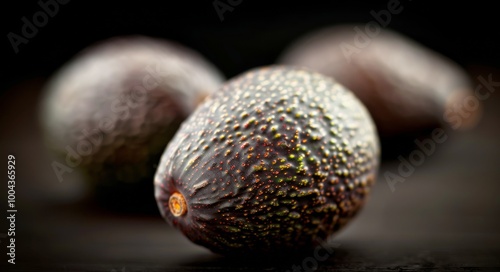 Fresh Avocados With Water Droplets on Dark Background