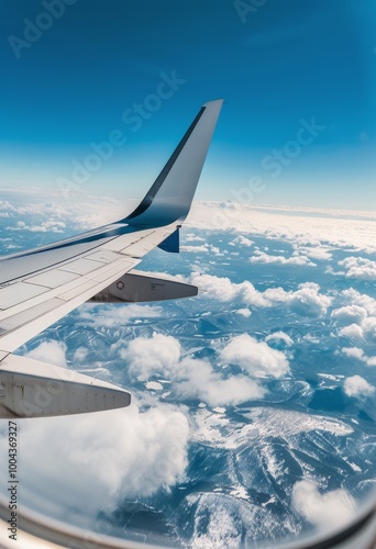 Aerial View From Airplane Wing Over Fluffy Clouds During Daylight
