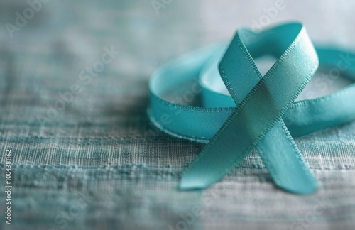 Delicate Blue Ribbon Curled on Gray Surface