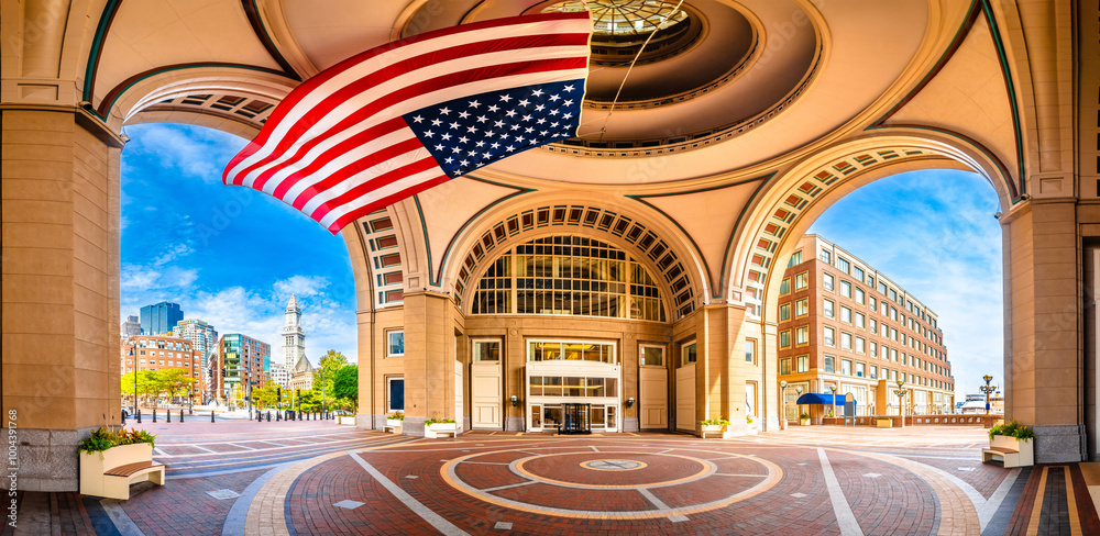 Boston harbor Rowes Wharf passage and cityscape panoramic view, large flag of America, Massachusetts
