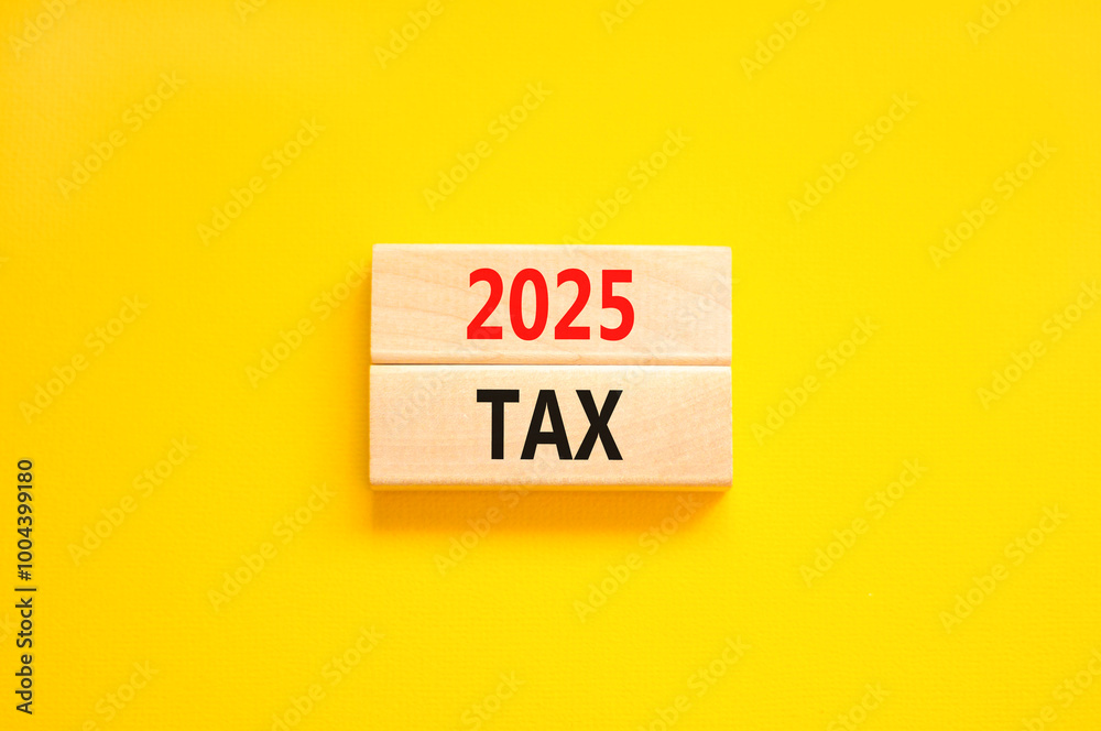 Naklejka premium Planning 2025 tax new year symbol. Concept words 2025 Tax on beautiful wooden blocks. Beautiful yellow background. Business 2025 tax new year concept. Copy space.